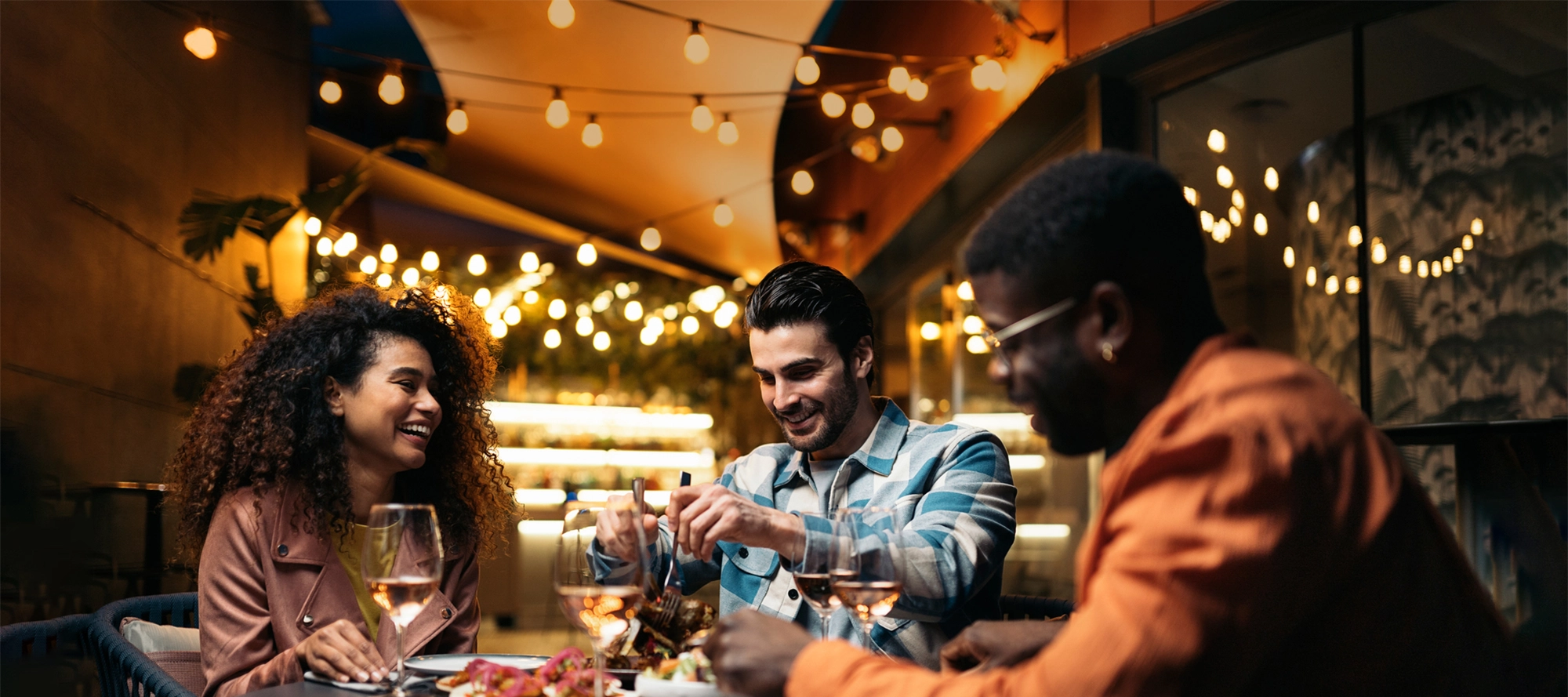 Friends laughing over dinner