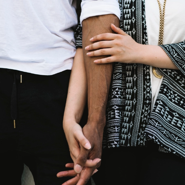 http://A%20close%20up%20of%20a%20couple%20holding%20hands